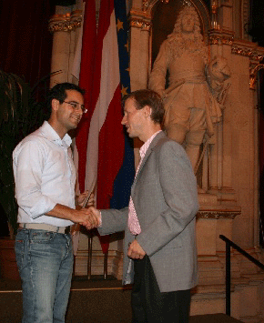 photo (70KB) : Christos Tryfonopoulos (left) receives the congratulations of Prof. Andreas Rauber, ECDL 2005 Program Chair